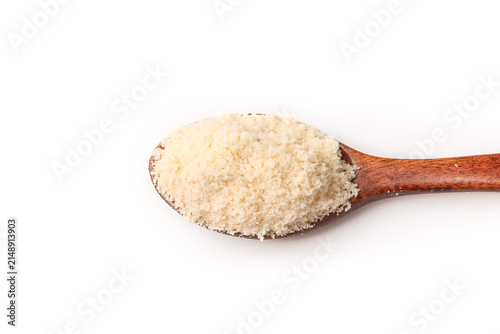 Cuadro en lienzo White granulated sugar in wooden spoon isolated on white background for baking a