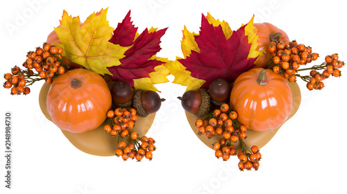 Autumnal arrangement with pumpkins maple leaves acorns, and berries