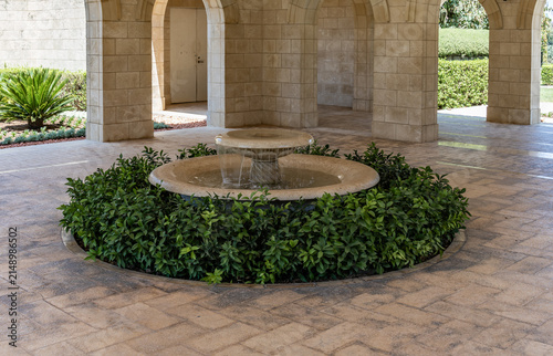 Decorative stone fountain at the entrance in Bahai Gardens near Acre city in northern Israel.