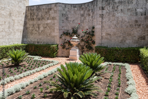 One of the courtyards decorated with greenery and decorative stone vessels in Bahai Gardens near Acre city in northern Israel.
