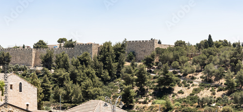 View from observation deck near the Montefiore Windmill of the outer stone defensive walls of Jerusalem Old City in Israel