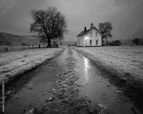 Monochrome Farmhouse Scene - A Lonely Road Leading Home on a Gloomy Day.