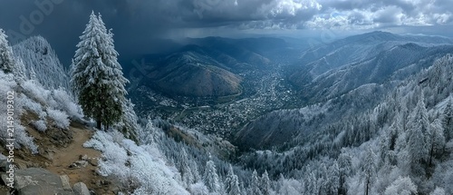 Winter Wonderland - Snow-Covered Mountains and Trees Under a Cloudy Sky.