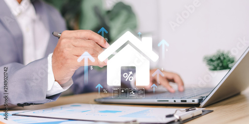 Real estate investment and mortgage concept with rising property value, home finance, interest rates, housing market, and digital financial planning.