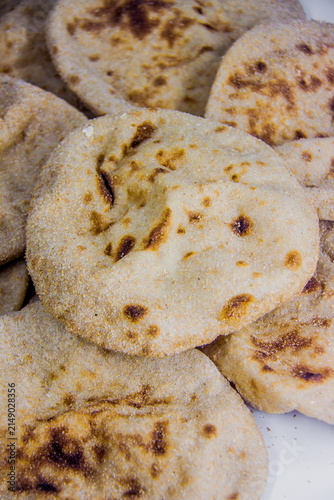 Egyptian baladi Bread Food Photography, breakfast, lunch, dinner,  traditional whole wheat flatbread known for its hearty texture and nutty flavor, selective focus, shallow depth of field, Cairo Egypt