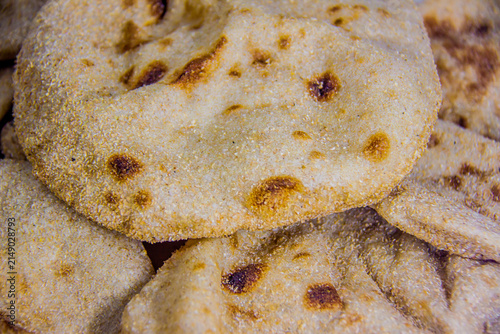 Egyptian baladi Bread Food Photography, breakfast, lunch, dinner,  traditional whole wheat flatbread known for its hearty texture and nutty flavor, selective focus, shallow depth of field, Cairo Egypt