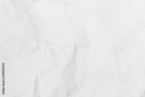White recycled craft paper texture as background. Grey paper texture, Old vintage page or grunge vignette of old newspaper. Pattern rough art creased grunge letter. Hardboard with copy space for text.