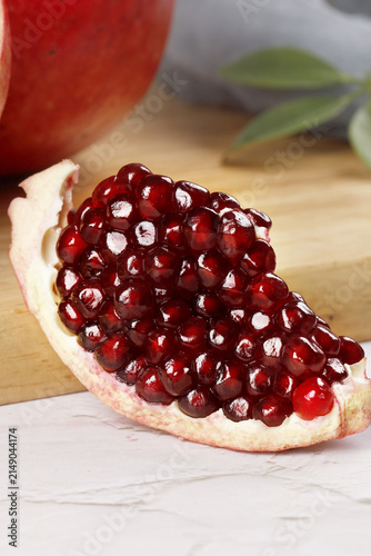 Canvastavla Fresh Pomegranate Arils from Panzhihua Yunnan China - Ruby Red Seeds on Wooden B