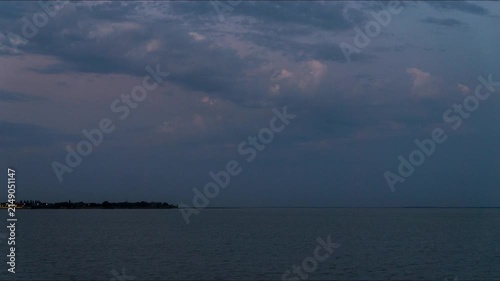 Timelapse: blue clouds and sea coast at twilight