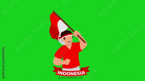 Indonesian youth wearing a red and white headband and waving Indonesian flag