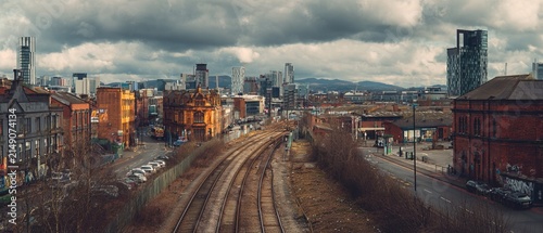 Urban Panorama - Manchester Cityscape Under Dramatic Cloudy Sky.