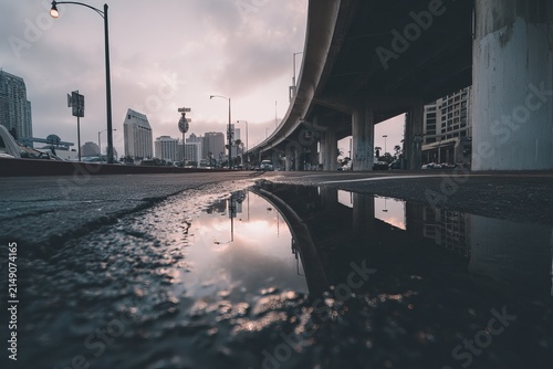 Urban Reflections - A Puddles View of Miamis Skyline and Infrastructure.
