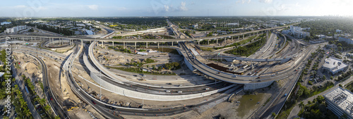 Aerial view of the Golden Glades Interchange featuring complex highway ramps, multi-level overpasses, and ongoing construction work in Miami, Florida, United States.