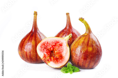 фотографія Fresh Red Figs with Exposed Flesh and Mint Garnish on White Background