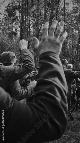 Captured WWII German soldiers marched by Soviet troops through forest