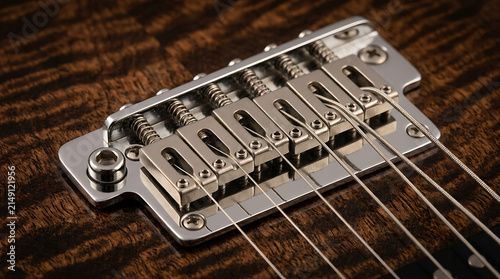 Detailed Close-up of an Electric Guitar Bridge with Strings and Chrome Hardware on Textured Wood