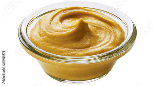 Foto Glass bowl of yellow mustard with swirl texture