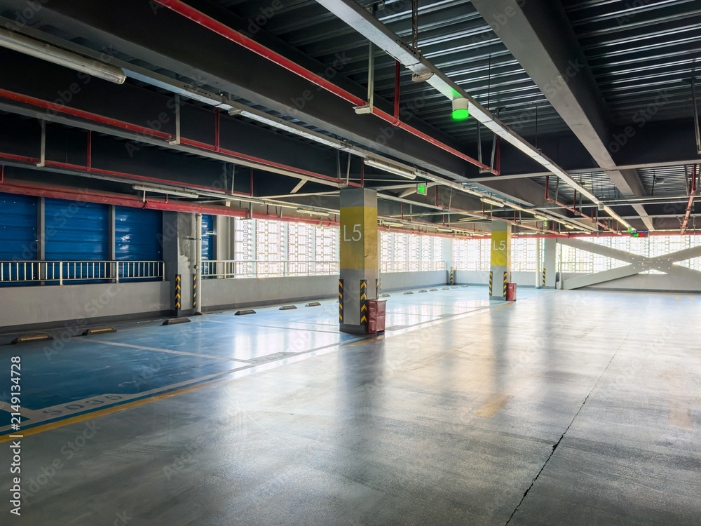 Fototapeta premium Modern Urban Parking Garage Interior with Clean Lines and Natural Light