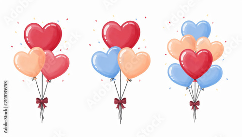 Colorful heart shaped balloons tied together in festive bunches