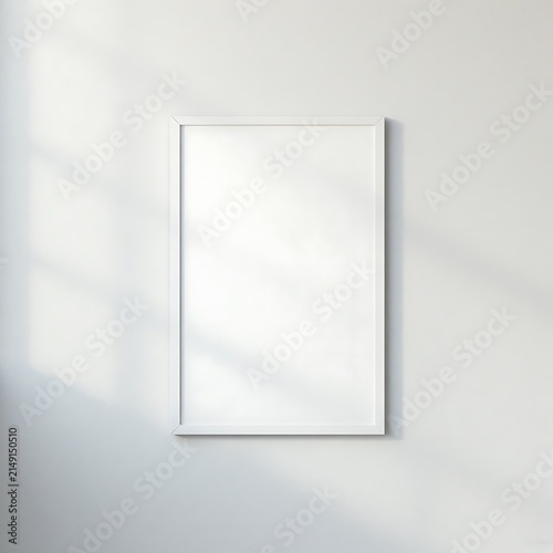 Minimalist white-framed poster hung on a light wall with soft shadows.