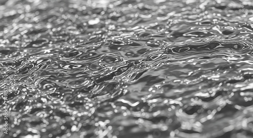 Close up view of water surface with ripples and reflections in monochrome