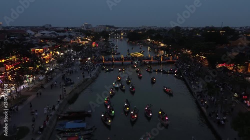 Romantic boats carrying tourists with colorful lanterns sailing on the thu bon river at night