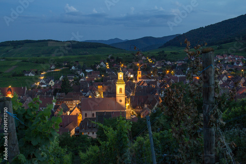 Blue Hour Summer Panorama of Riquewihr Village and Vineyards in Alsace, France