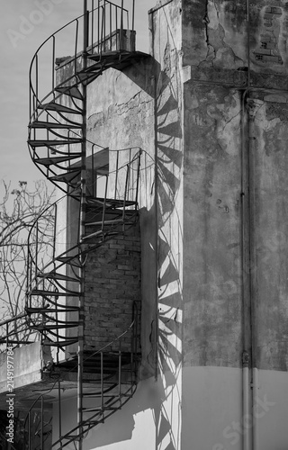 Outdoor old spiral narrow stairs in the abandoned building