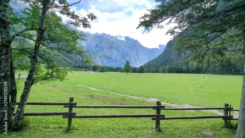 Breathtaking panoramic view of green Logar valley and high alpine mountain peaks in Slovenia