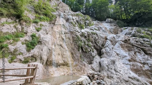 Summer Palenk waterfall cascading down steep rocks in Logar valley Slovenia