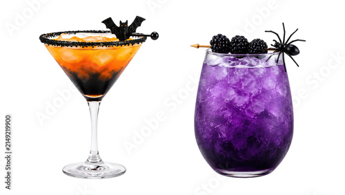 Two Halloween-themed cocktails: an orange layered martini with a bat garnish and black sugar rim, and a purple blackberry crushed-ice drink topped with blackberries and a plastic spider