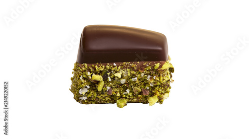 Fotografie Chocolate candy with crushed pistachios and white sugar crystals