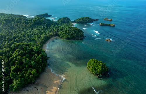 a beautiful beach with tide, sand and island view in Madasari, Pangandaran Regency, West Java, Indoensia