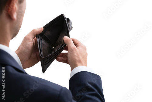 Businessman looking into an empty brown leather wallet