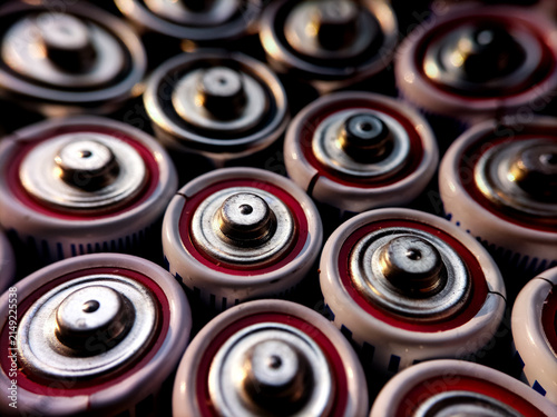 Quadro su tela Close-up shot focusing on the positive terminals of electronic cylindrical battery cells