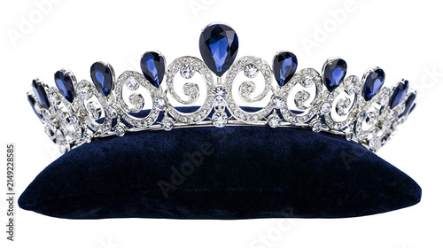 Fotografie Silver tiara with blue teardrop and round crystals on velvet cushion