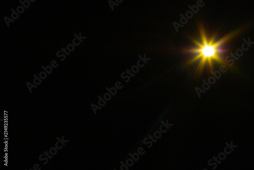 Sun flare on the black background
