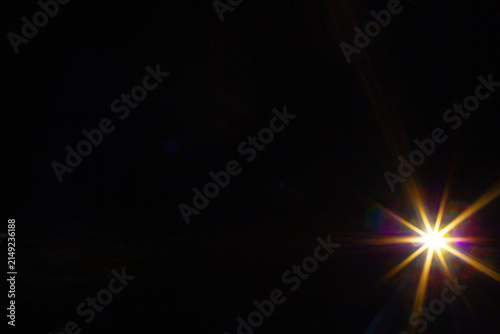 Sun flare on the black background