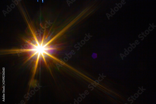 Sun flare on the black background