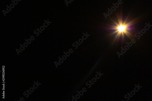 Sun flare on the black background