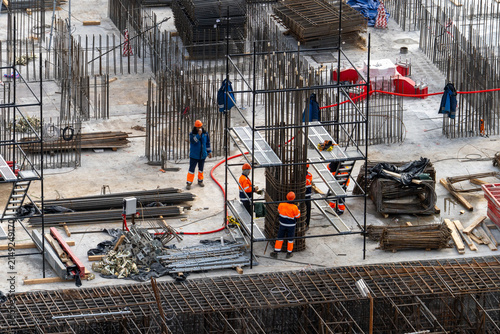 Fotografie Builders in overalls at a construction site, top view