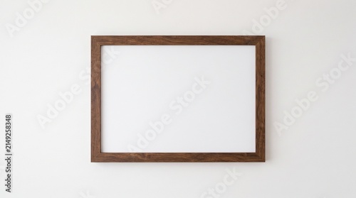 Konstfotografi Minimalist wooden picture frame on white wall