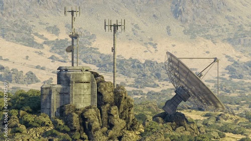Weathered satellite dish next to bunker, close framing reveals support struts and coaxial cables, rusted mounts and nearby antenna mast, receiver cabin