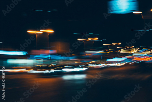 Dynamic Light Trails from Vehicles on a City Street at Night