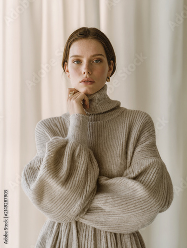 Young Woman in Beige Turtleneck Looking at Camera