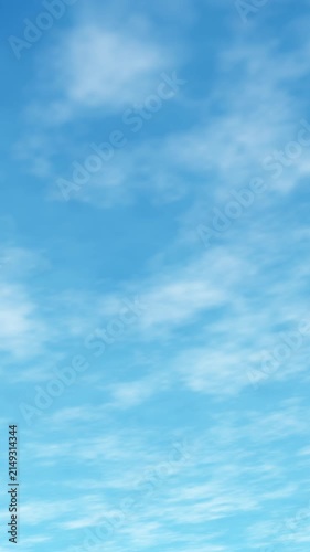 Vertical seamless loop clear blue sky with softly moving white clouds