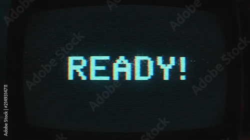 Retro 8-Bit Pixel Art READY Text Animation on Glitchy CRT Monitor Screen.