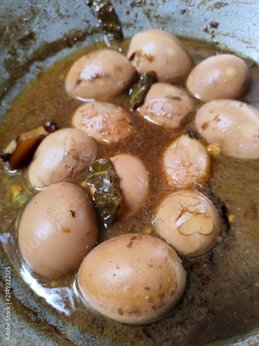 Bild auf Leinwand A dish of hard-boiled eggs braised in sweet soy sauce, offering a savory flavor