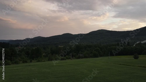 Aerial drone view of cloudy sky and epic mountains during amazing warm sunset. Nature inspiration. Calming peace. Destination for tourism and wanderlust. Summer beautiful landscape