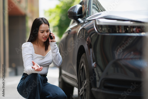 Konstfotografi Young woman calling for help with car trouble, experiencing stress and problems